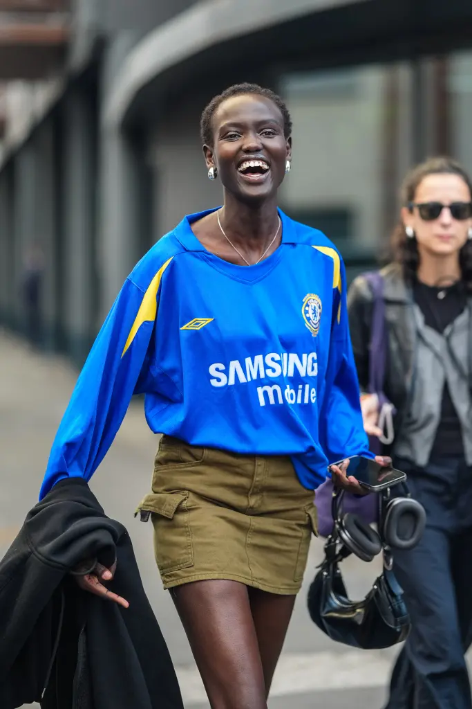 Street style portrait of a fan wearing a vintage Chelsea Samsung Mobile jersey